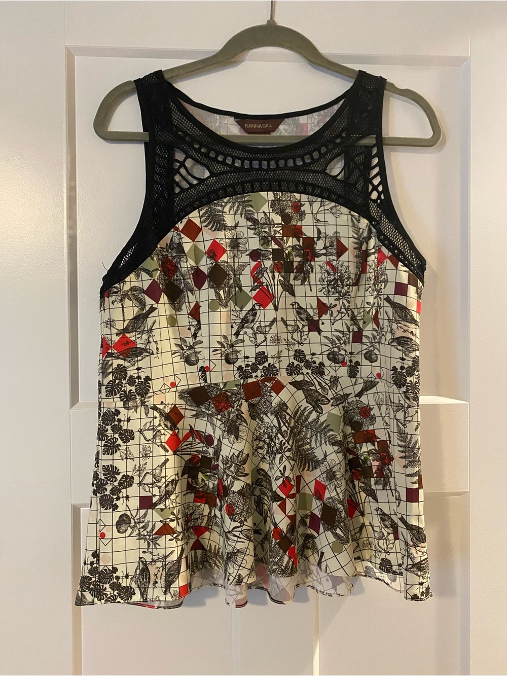 Anthropologie- Ranna Gill Printed Statement Top. Crochet detail/peplum waist.